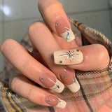Fashionkova 24Pcs Long Coffin False Nails with Star Rhinestones Black Y2K Nail Art French Gradient Full Cover Press on Nail Tips for Girls
